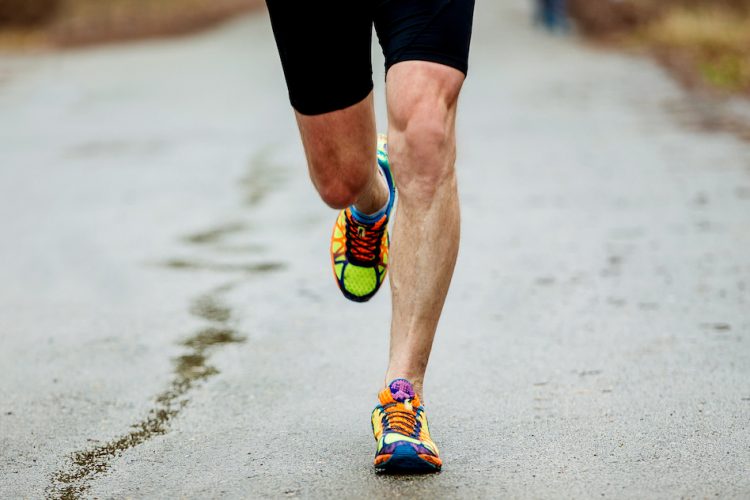 Man running with shin pain - shin splints